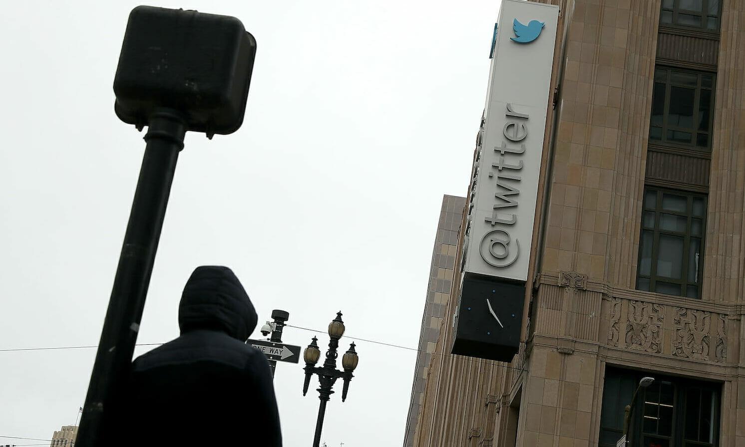 A sign is posted on the exterior of Twitter headquarters in San Francisco, California. The company warned developers that a bug may have exposed their APIs and tokens. (Justin Sullivan/Getty Images)