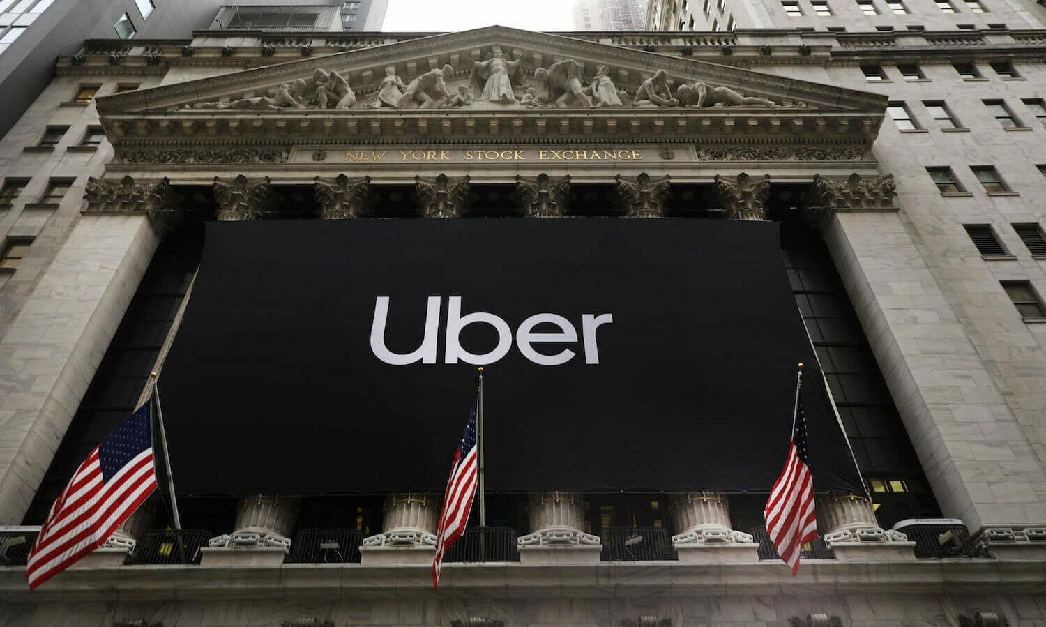 A banner with Uber's logo hangs outside the New York Stock Exchange