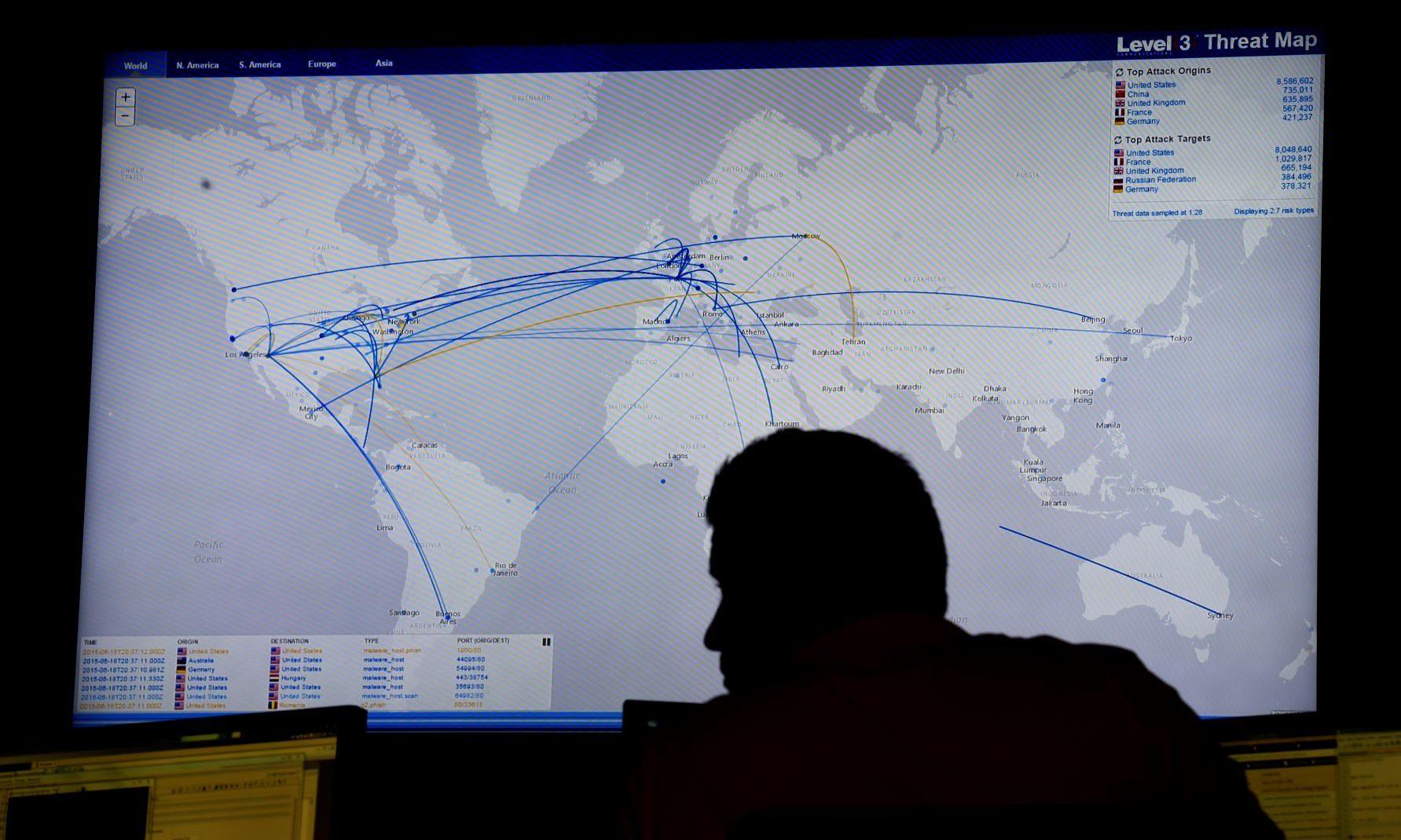 A security technician in a security operation center monitors hackers worldwide on a threat map. (Photo by Helen H. Richardson/ The Denver Post)