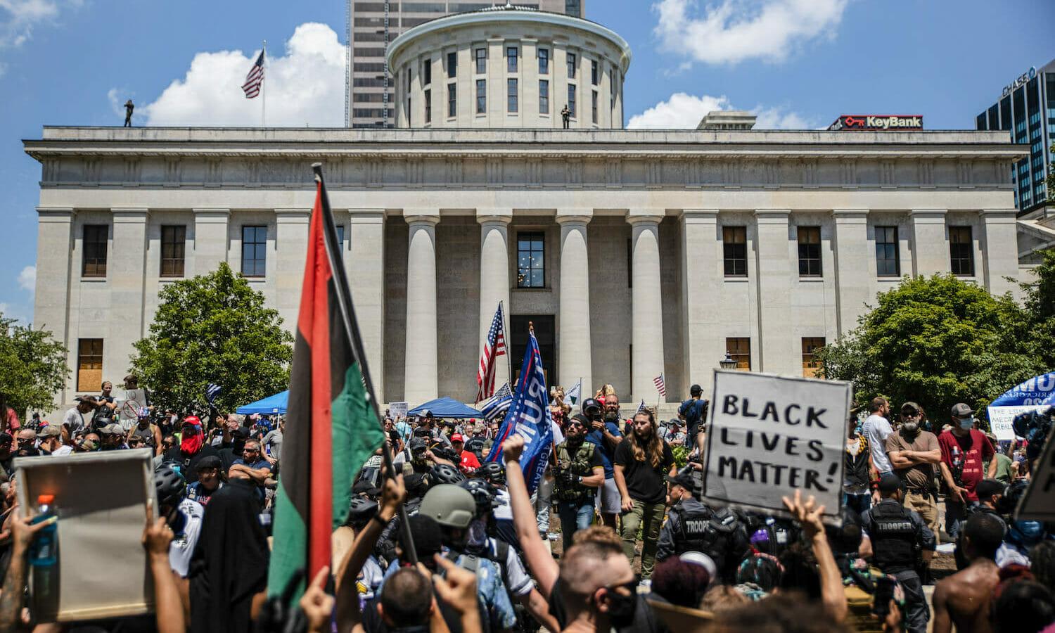 COLUMBUS, UNITED STATES &#8211; 2020/07/18: Anti-Mask protesters collide with Black Lives Matter counter-protesters during an &#8216;Anti-Mask&#8217; rally, Black Lives Matter protest at Ohio Statehouse.
Over 200 people gathered at the Ohio State House to protest against the face mask mandate that multiple counties are under in the state. (Photo by...
