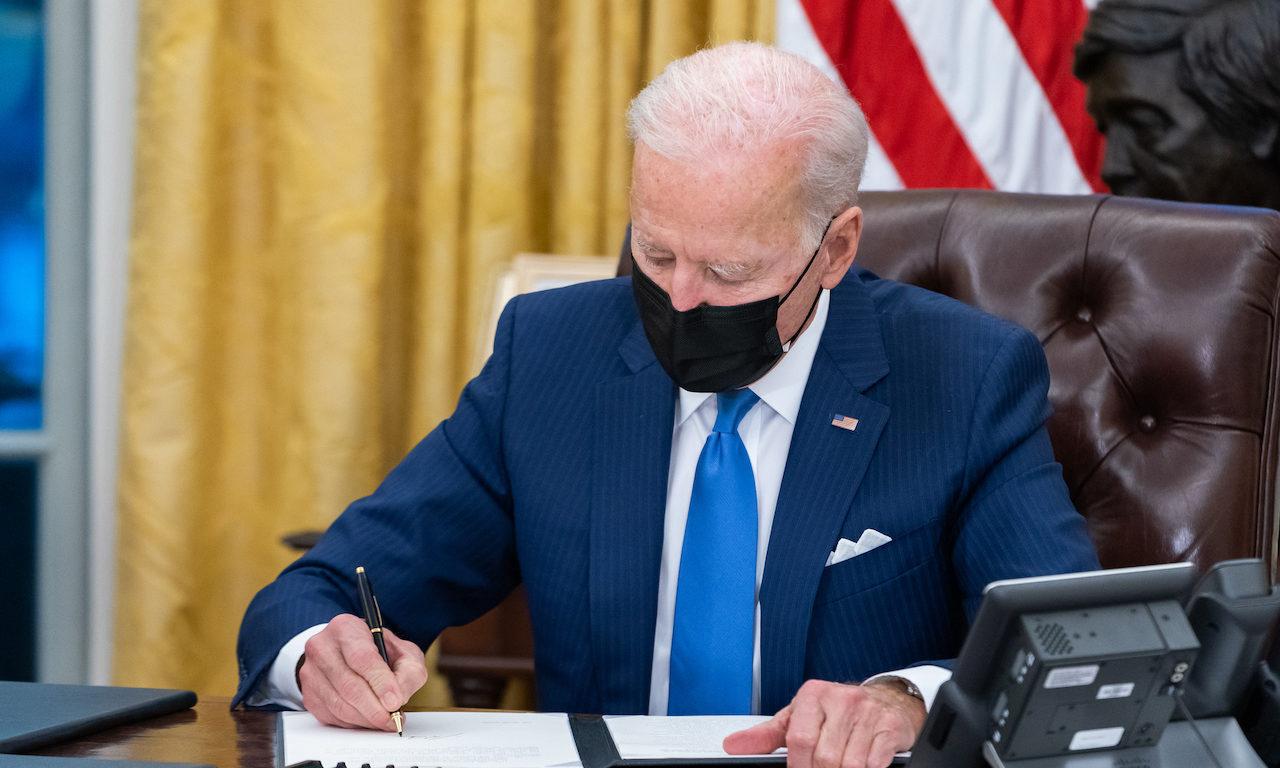 President Joe Biden signs executive orders on immigration Tuesday, Feb. 2, 2021, in the Oval Office of the White House. As the Biden administration pushes the government to adopt zero trust architectures, OMB&#8217;s top security official said smaller or independent agencies will need to be held to different standards on adoption. (Official White H...
