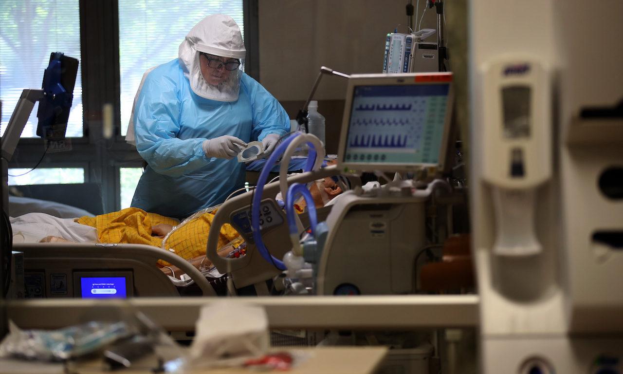 A nurse cares for a coronavirus COVID-19 patient in the intensive care unit at Regional Medical Center on May 21, 2020 in San Jose, California. (Photo by Justin Sullivan/Getty Images)