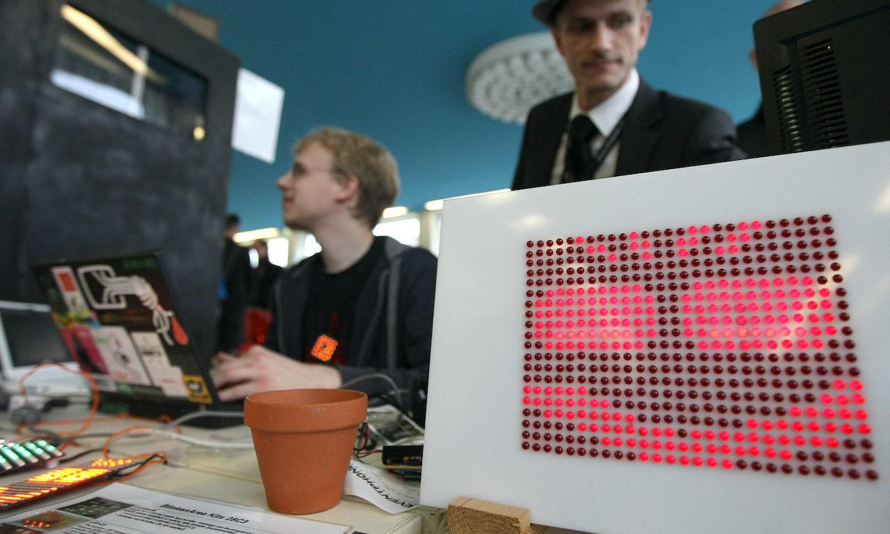 Participants in the BlinkenArea project work behind a sinister panel of LED lights during a computer hacker conference. (Photo by Adam Berry/Getty Images)