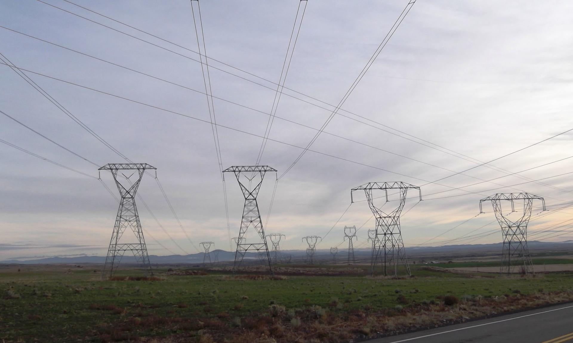 Power lines distribute hydropower from a dam on the Columbia River in Washington state. The Biden administration on Wednesday announced an initiative to improve the cybersecurity of critical infrastructure. (By brewbooks, CC BY-SA 2.0, https://commons.wikimedia.org/w/index.php?curid=52426263)