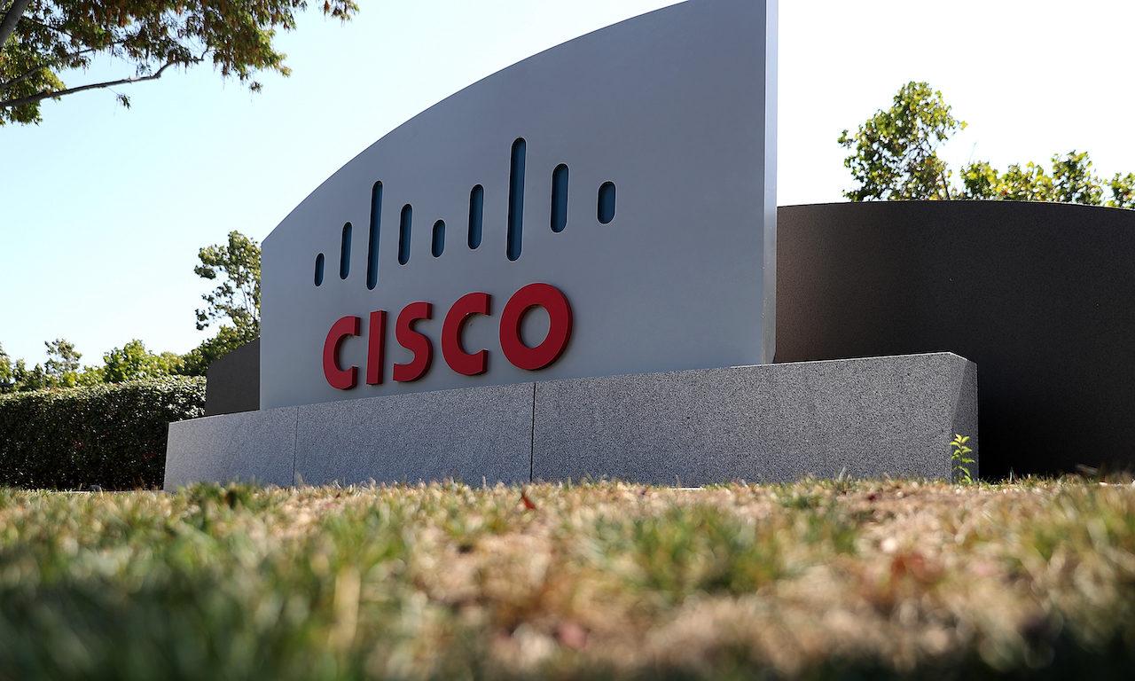 A sign is posted in front of the Cisco Systems headquarters  in San Jose, California. (Photo by Justin Sullivan/Getty Images)