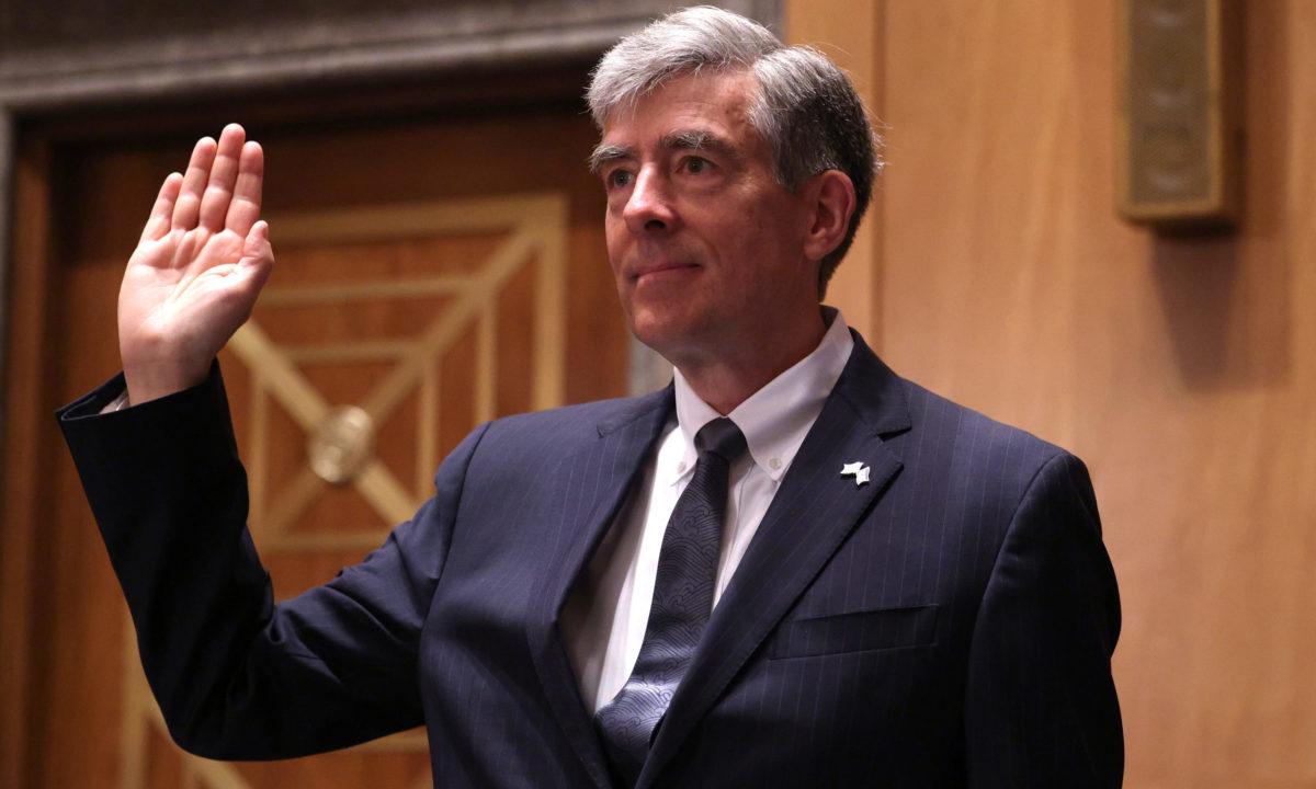 Chris Inglis, nominee to be the national cyber director, is sworn-in during his confirmation hearing before the Senate Homeland Security and Governmental Affairs Committee on June 10, 2021, in Washington. Inglis sketched out a vision for how the Biden administration intends to divvy up cybersecurity responsibilities to an increasingly crowded room ...