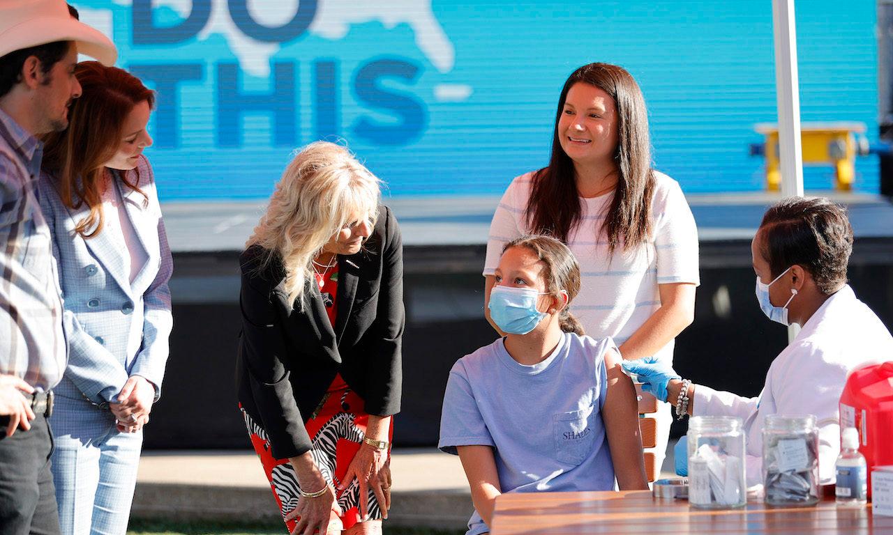 Singer Brad Paisley, Kimberly Williams-Paisley, and First Lady Jill Biden tour a Pop-Up Vaccination site this past June in Nashville, Tenn. Today’s columnist, Bert Kashyap of SecureW2, says as more people are vaccinated, companies will have to make some tough decisions about hybrid work environments. (Photo by Jason Kempin/Getty Images)