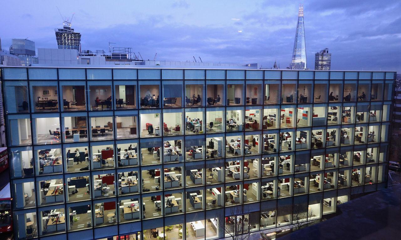 People work at dusk on various floors of a modern office development in London, England. A new study noted the risks that can come with subsidiaries. (Photo by Oli Scarff/Getty Images)