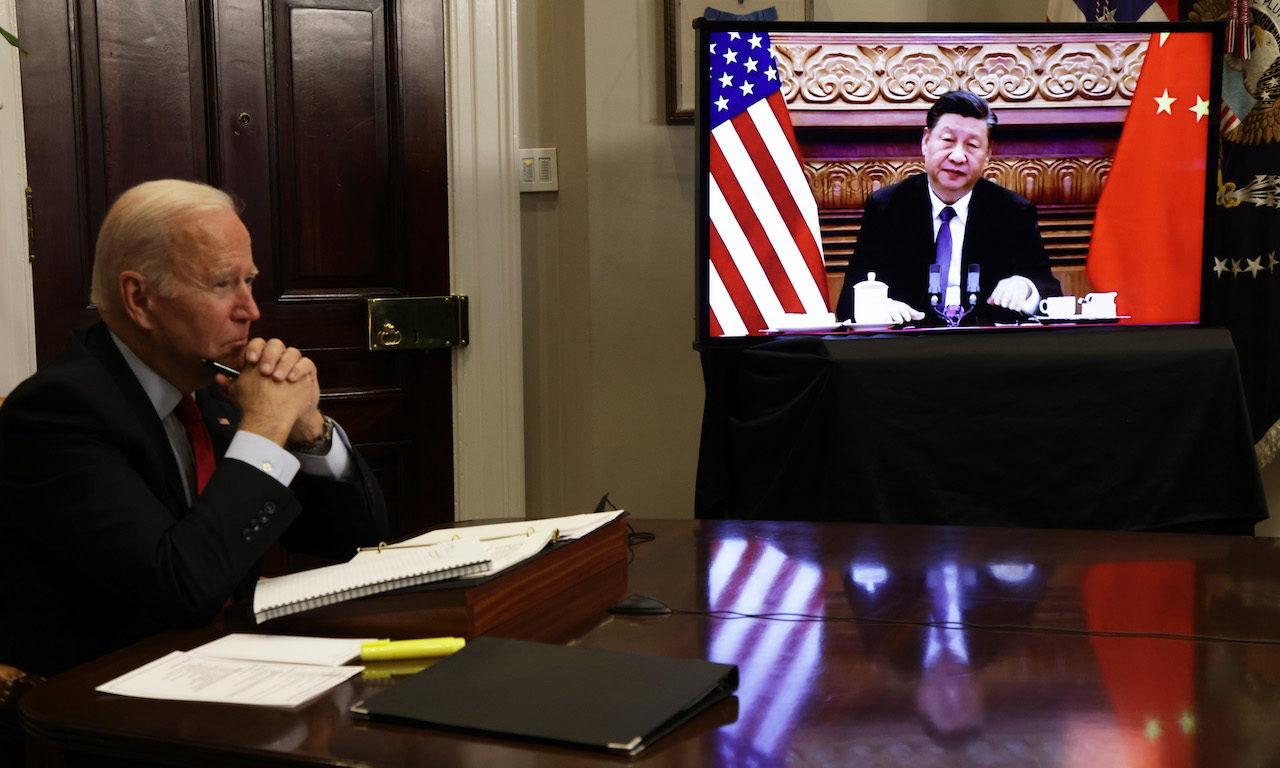U.S. President Joe Biden participates in a virtual meeting with Chinese President Xi Jinping at the White House on Nov. 15, 2021, in Washington,. A hacking group tied to the Chinese government has exploited zero-day vulnerabilities in internet facing web applications — including Log4j — to compromise the networks of at least six U.S. state governme...