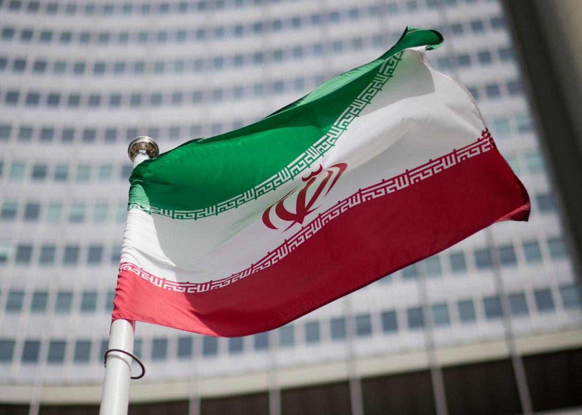 The flag of Iran is seen in front of the building of the International Atomic Energy Agency (IAEA) Headquarters on May 24, 2021, in Vienna.  (Photo by Michael Gruber/Getty Images)