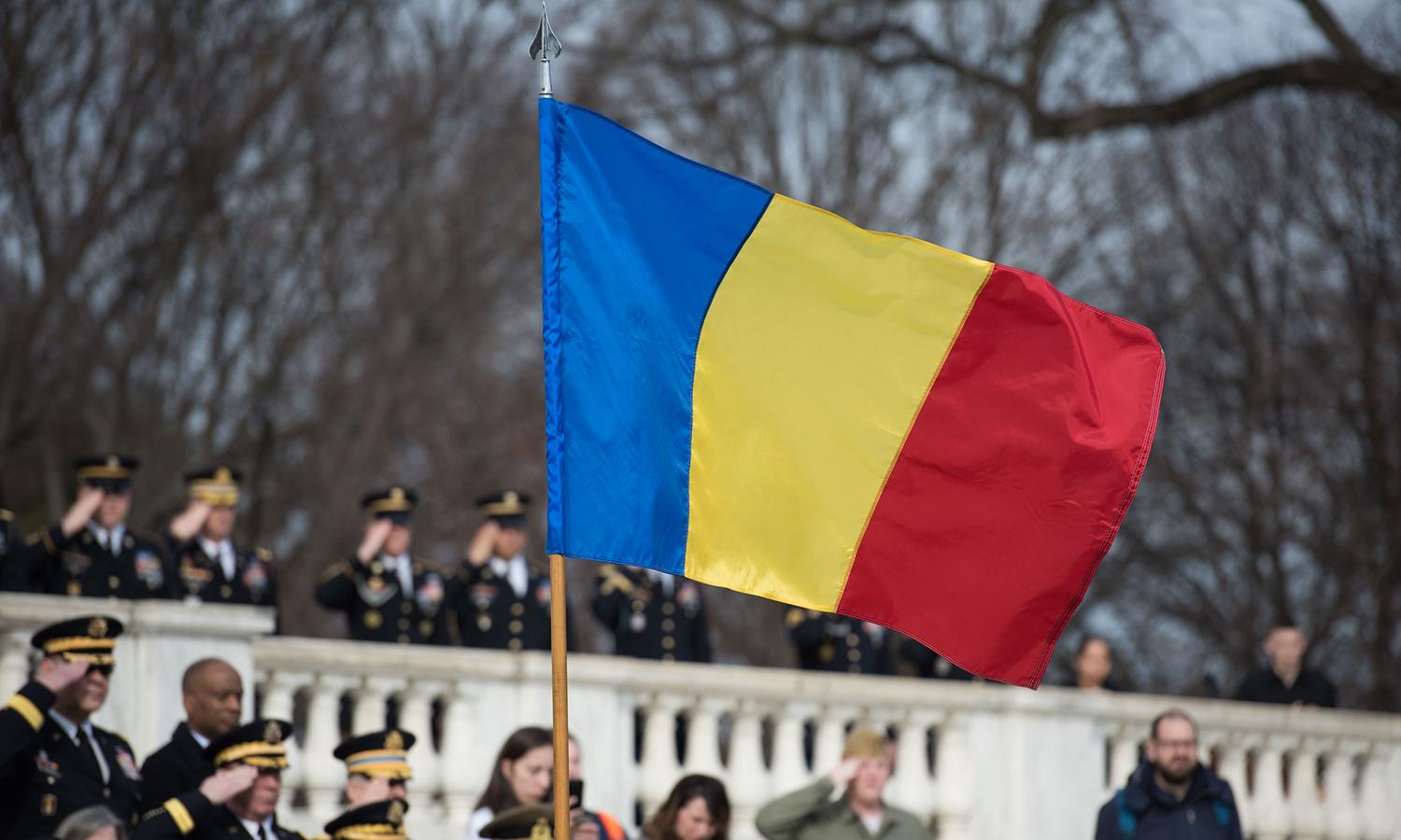 Romanian police announced the arrest of members of the REvil ransomware group on Nov. 8. Pictured: The Romanian flag flies Feb. 7, 2017, during an armed forces ceremony at Fort Meyer, Va., Feb. 7, 2017. (Pfc. Gabriel Silva/US Army)