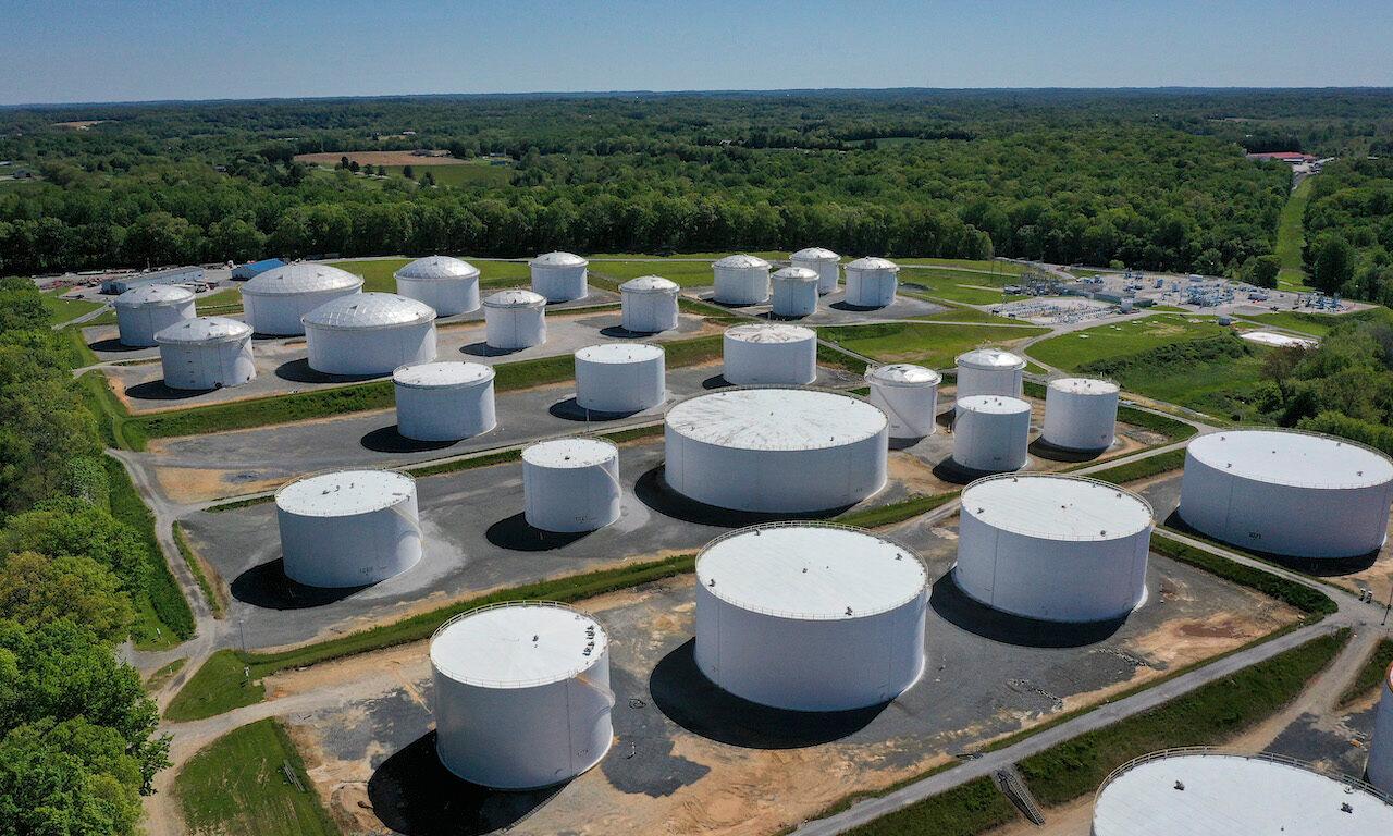 In an aerial view, fuel holding tanks are seen at Colonial Pipeline's Dorsey Junction Station on May 13, 2021 in Woodbine, Md.