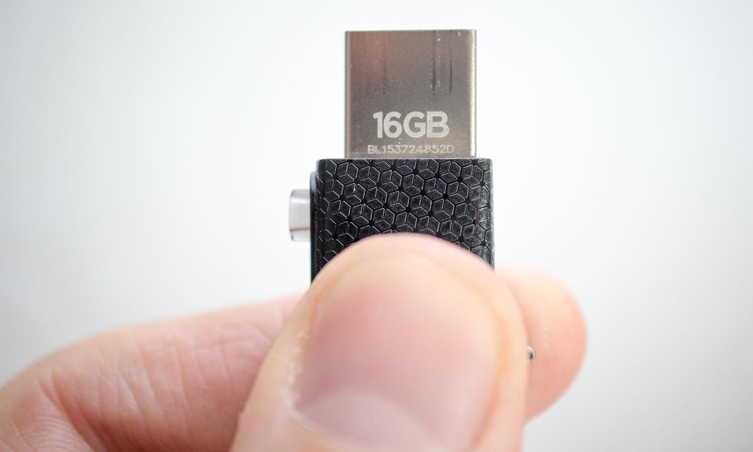 The FIN7 cyber gang is sending malicious USB devices to U.S. companies, the FBI warned in an alert. (&#8220;Man holding a USB drive in hand. Handing over top secret data&#8221; by Ivan Radic is licensed under CC BY 2.0)