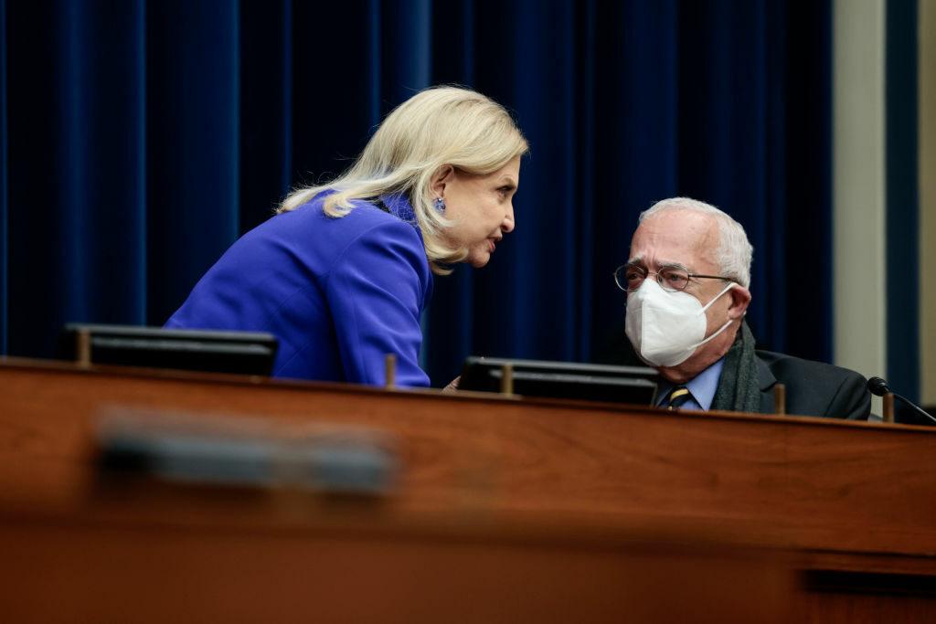 Chairwoman Carolyn Maloney, D-N.Y., speaks with Rep. Gerald Connolly, D-Va., during a hearing with the House Committee on Oversight and Reform on Nov. 16 in Washington. The committee released a draft bill to overhaul FISMA, but some are warning that adding new bureaucratic complexities may not improve federal cybersecurity. (Photo by Anna Moneymake...