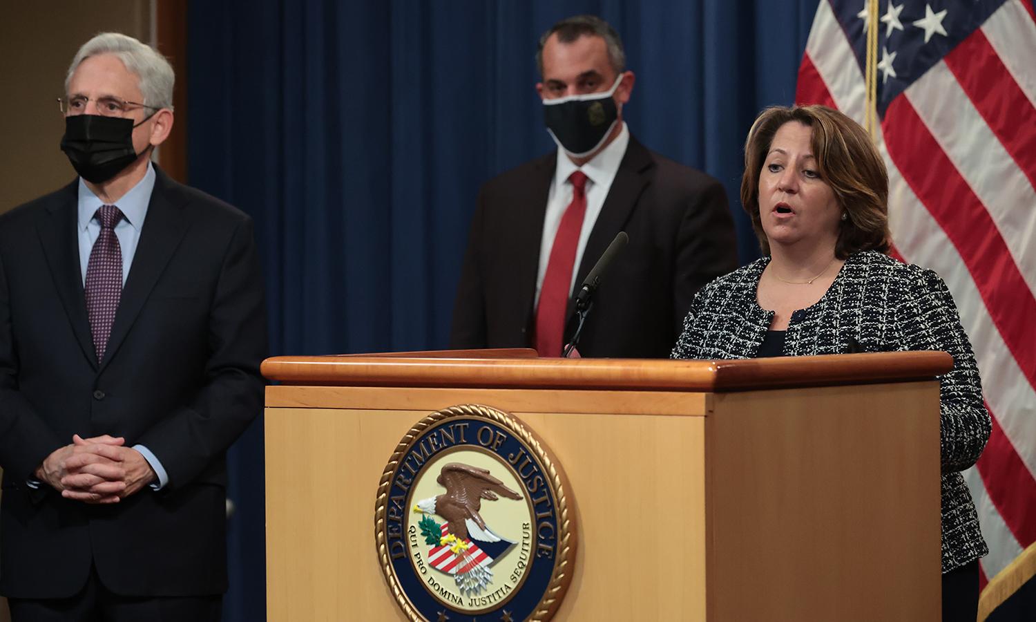 U.S. Deputy Attorney General Lisa Monaco, right, speaks during a news conference with Attorney General Merrick Garland and other law enforcement officials at the Robert F. Kennedy Main Justice Building on Nov. 8, 2021, in Washington. A civil settlement could boost DoJ efforts to sue or fine contractors for cybersecurity violations, but experts say ...