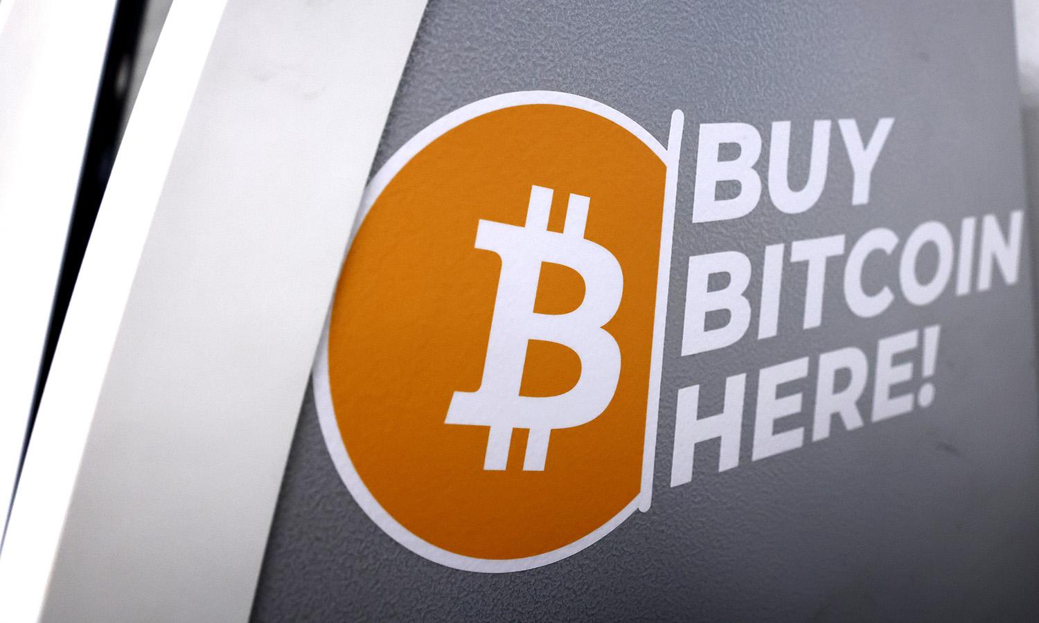 The Bitcoin logo is displayed on the side of a Bitcoin ATM on Nov. 10, 2021, in Los Angeles. (Photo by Mario Tama/Getty Images)