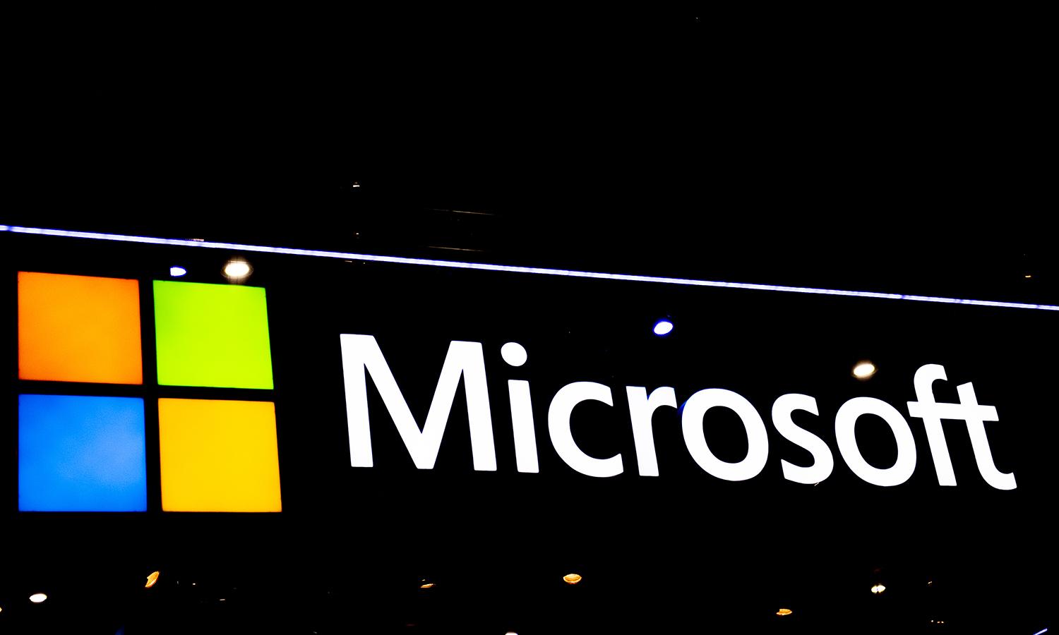 A logo sits illuminated outside the Microsoft booth at the SK telecom booth of the GSMA Mobile World Congress on Feb. 28, 2022, in Barcelona, Spain. (Photo by David Ramos/Getty Images)