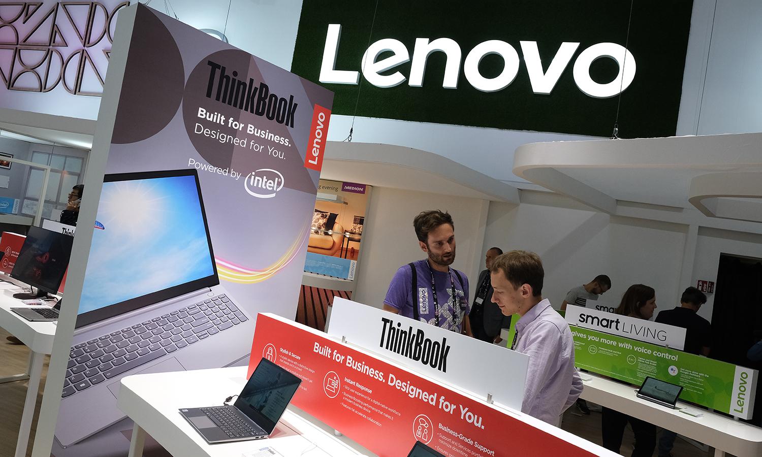 A visitor looks at new laptop computers on display at the Lenovo stand at the 2019 IFA home electronics and appliances trade fair on Sept. 6, 2019, in Berlin. (Photo by Sean Gallup/Getty Images)