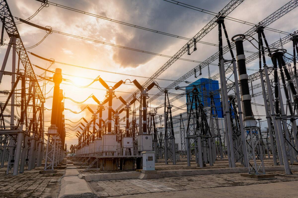 High voltage substation under sunset. The Department of Energy is putting $12 million behind six university-led cybersecurity research projects that look for innovative ways to securely build or design the nation’s energy systems. (Photo Credit: bjdlzx via Getty Images)