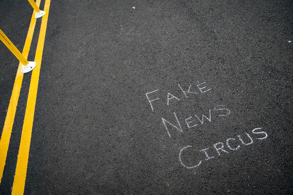 A chalk message about &#8220;Fake News&#8221; is written on the street at Black Lives Matter Plaza near the White House, on Nov. 5, 2020, in Washington,. DHS is facing heat for its newly-created disinformation board, but officials have long-puzzled over how to tackle disinformation without treading on Americans&#8217; rights. (Photo by Al Drago/Get...