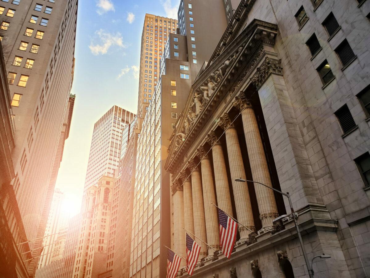 Newly proposed rules would force member companies to take a range of actions to modernize their business networks and protect against hacking threats. Pictured: Historic buildings of Wall Street in the financial district of New York City. (Photo Credit: deberarr via Getty)