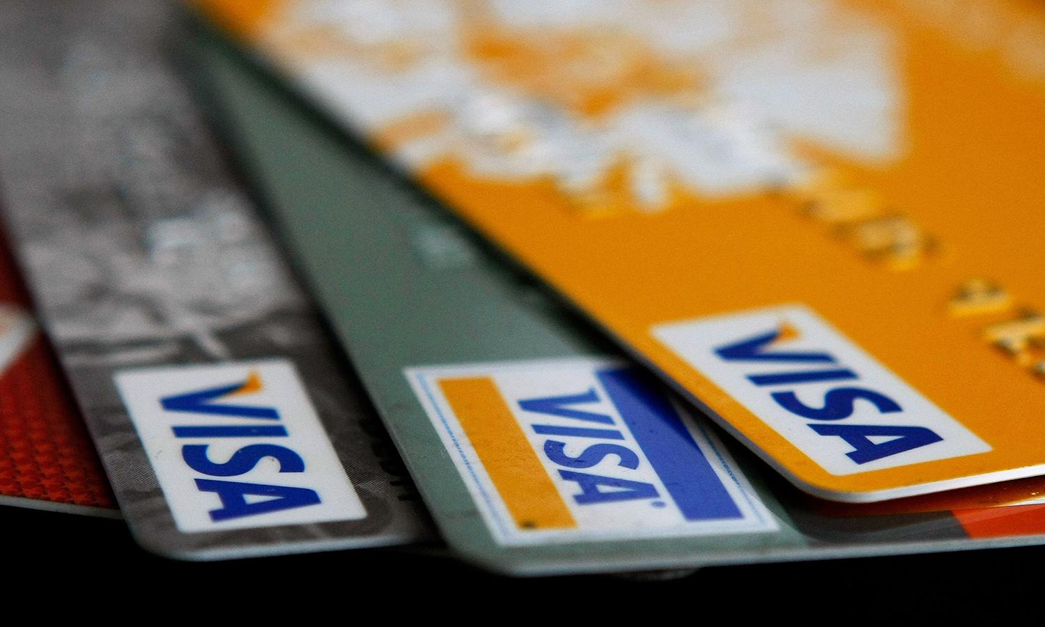 Magecart attacks continue to operate to steal payment data, albeit more covertly, according to Malwarebytes. Pictured: Visa credit cards are arranged on a desk Feb. 25, 2008, in San Francisco. (Photo by Justin Sullivan/Getty Images)