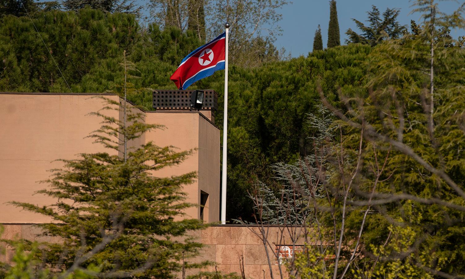 Federal agencies issued an alert warning of state-sponsored North Korean actors using the Maui ransomware to target the health sector. Pictured: A flag of North Korea waves in the wind on a post at the North Korean Embassy on March 27, 2019, in Madrid. (Photo by Pablo Blazquez Dominguez/Getty Images)