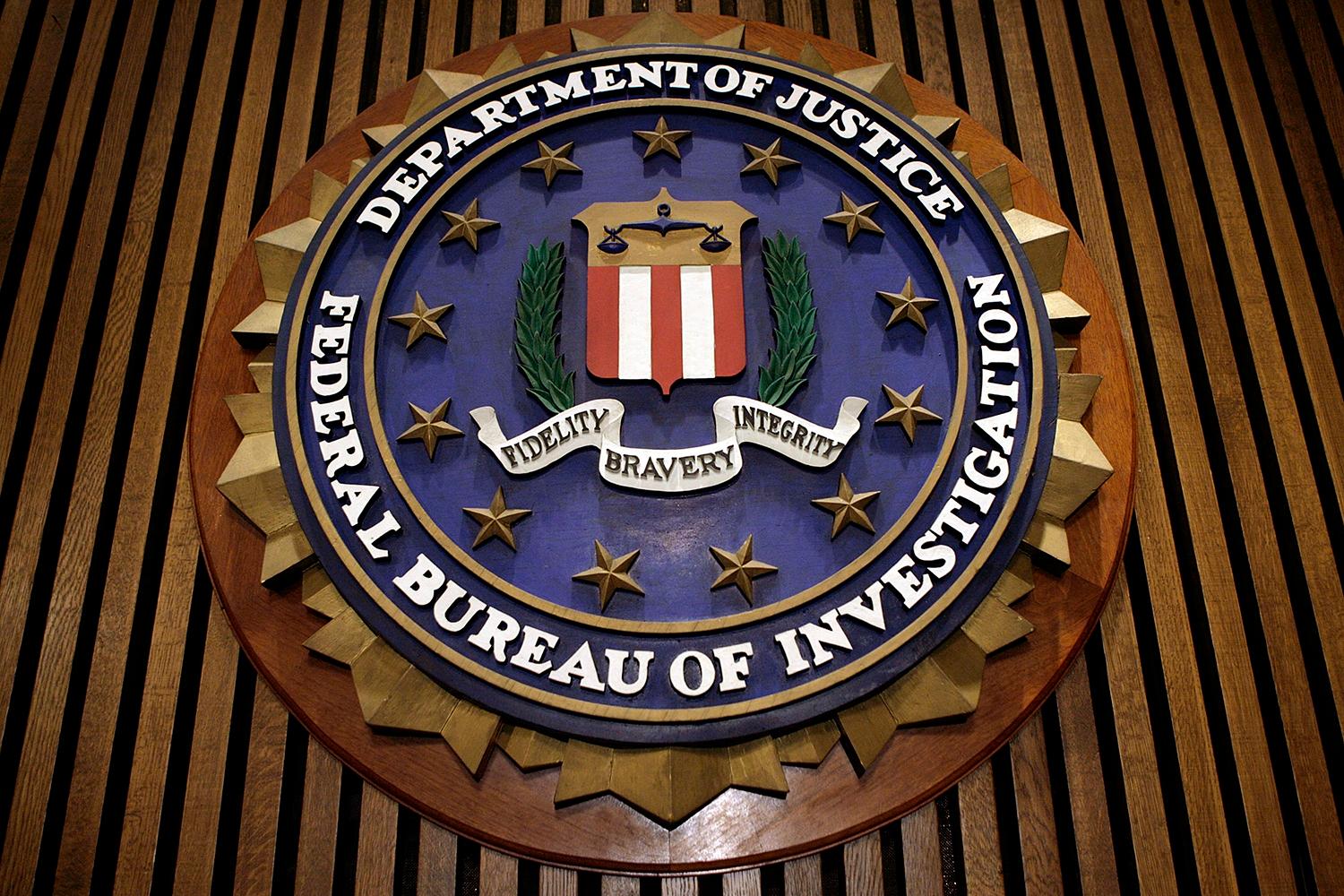 The seal of the FBI hangs at the bureau&#8217;s headquarters March 9, 2007, in Washington. (Photo by Chip Somodevilla/Getty Images)