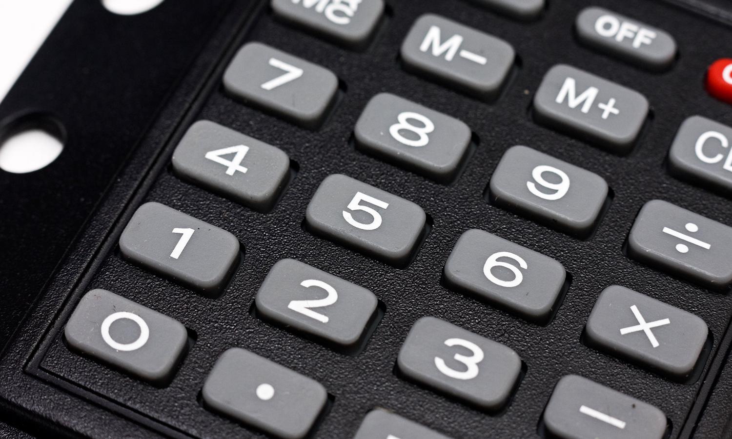 A close-up of the gray buttons of a black calculator