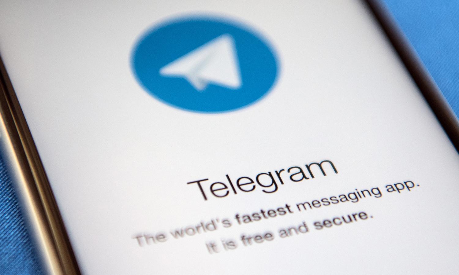 A close-up view of the Telegram messaging app is seen on a smartphone screen.