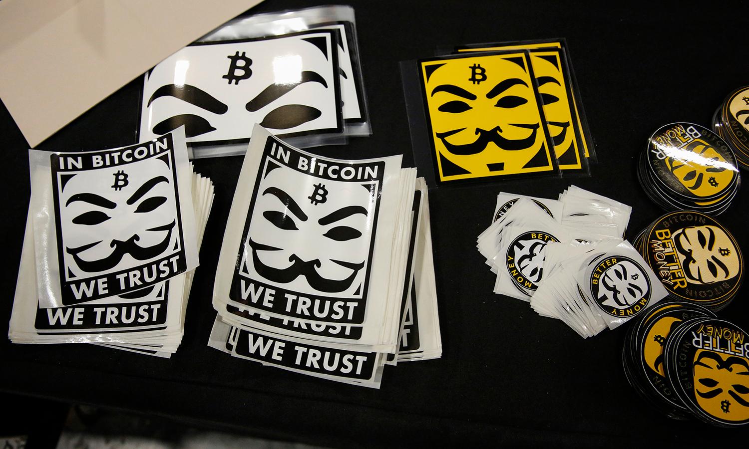 Stickers depicting Guy Fawkes masks (Anonymous mask) and the bitcoin logo