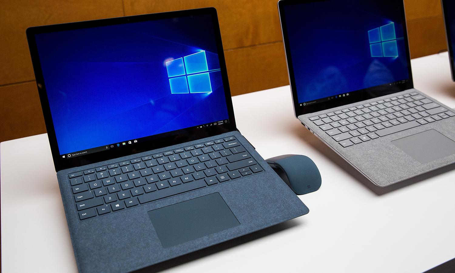 Two Microsoft Surface laptops are seen