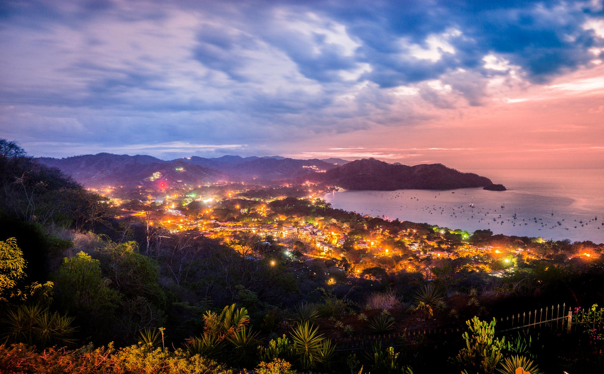 Looking down on Playas del Coco, Guanacaste, Costa Rica at night. The computer networks of dozens of Costa Rican ministries were infected with ransomware and a national emergency was declared in May by incoming President Rodrigo Chaves Robles shortly after he was sworn in. (Photo Credit: Fertnig via Getty)