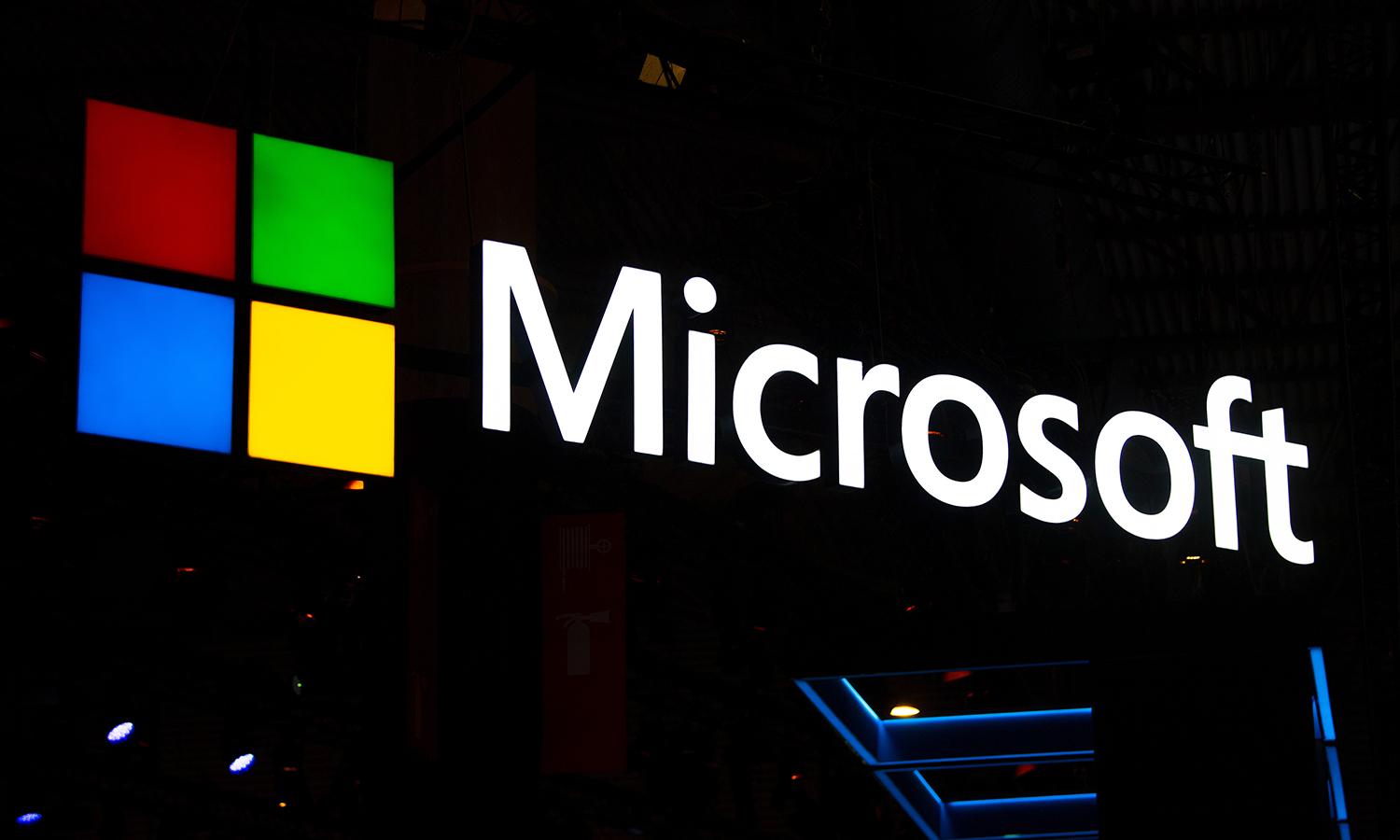 A Microsoft logo is illuminated at the GSMA Mobile World Congress 2019 on Feb. 26, 2019, in Barcelona. (Photo by David Ramos/Getty Images)