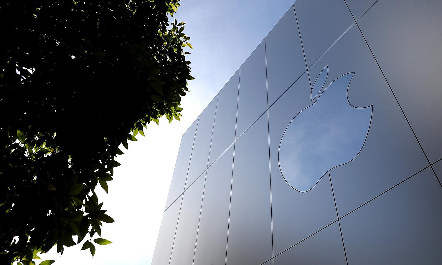 The Apple logo is displayed on the exterior of an Apple Store on Feb. 1, 2018, in San Francisco. (Photo by Justin Sullivan/Getty Images)