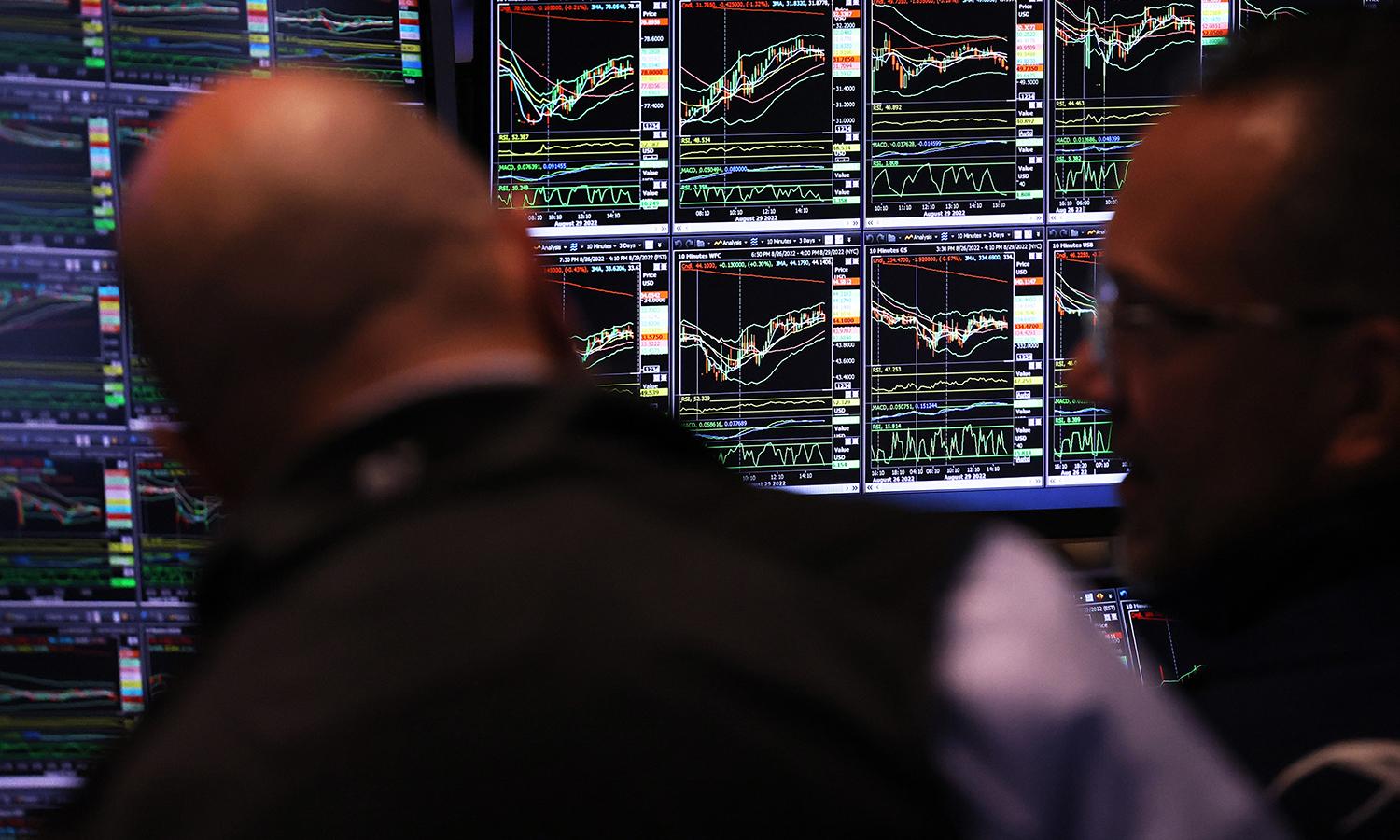 Screens show stocks being traded at the New York Stock Exchange