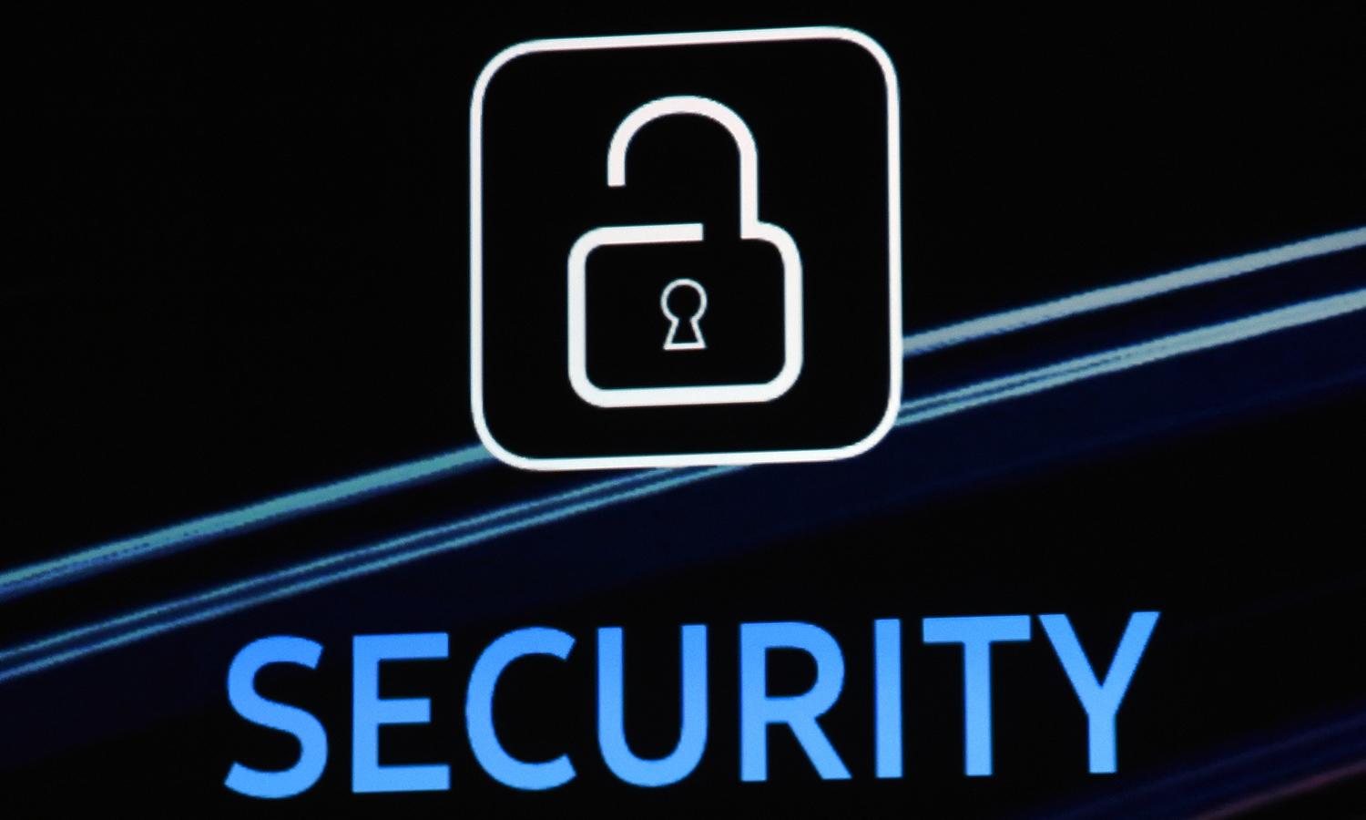 A security logo is shown on screen during a keynote address.