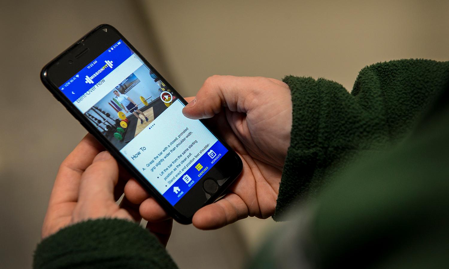 A smartphone user navigates a health and wellness app.