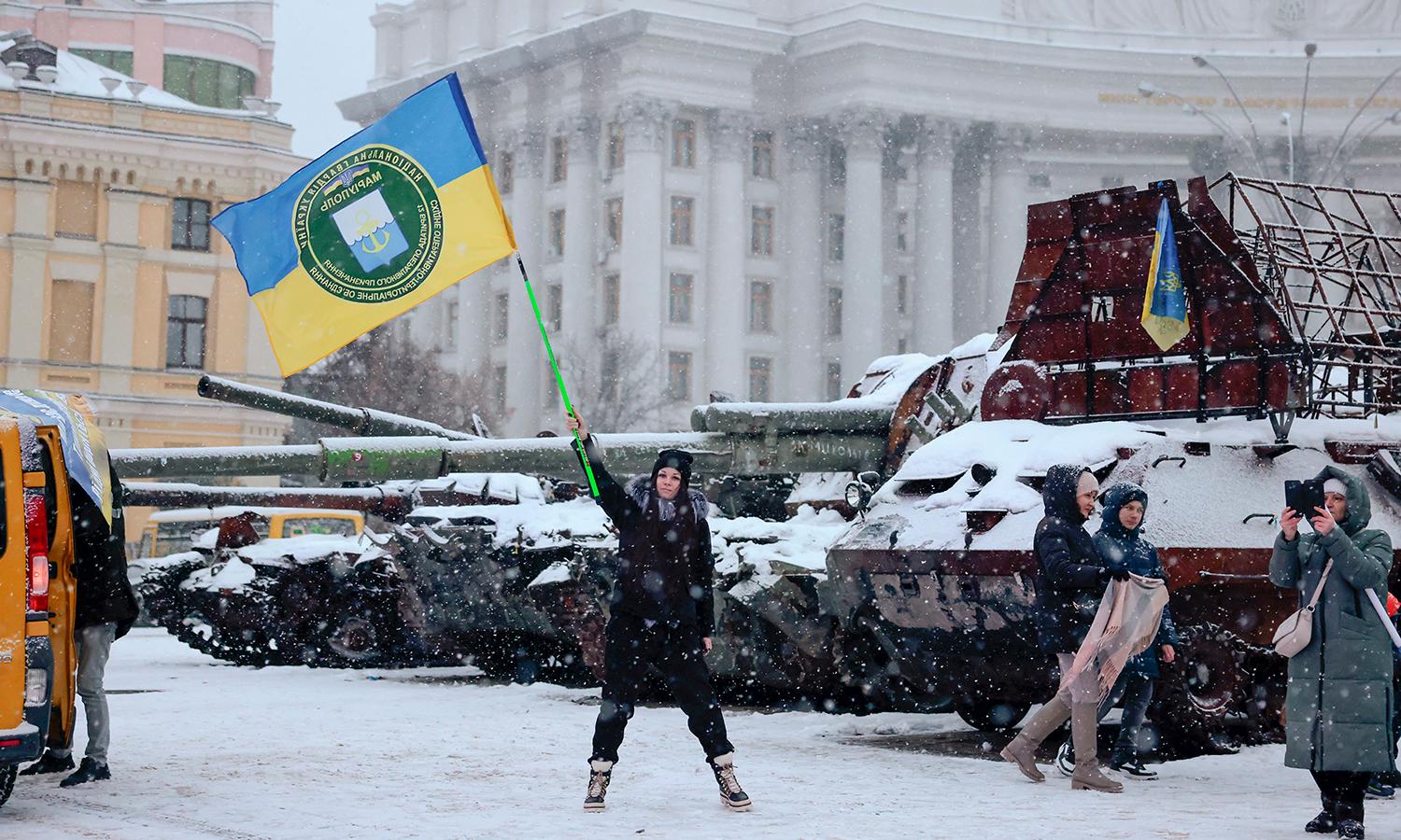 A protester waves a Ukrainian flag in Kyiv