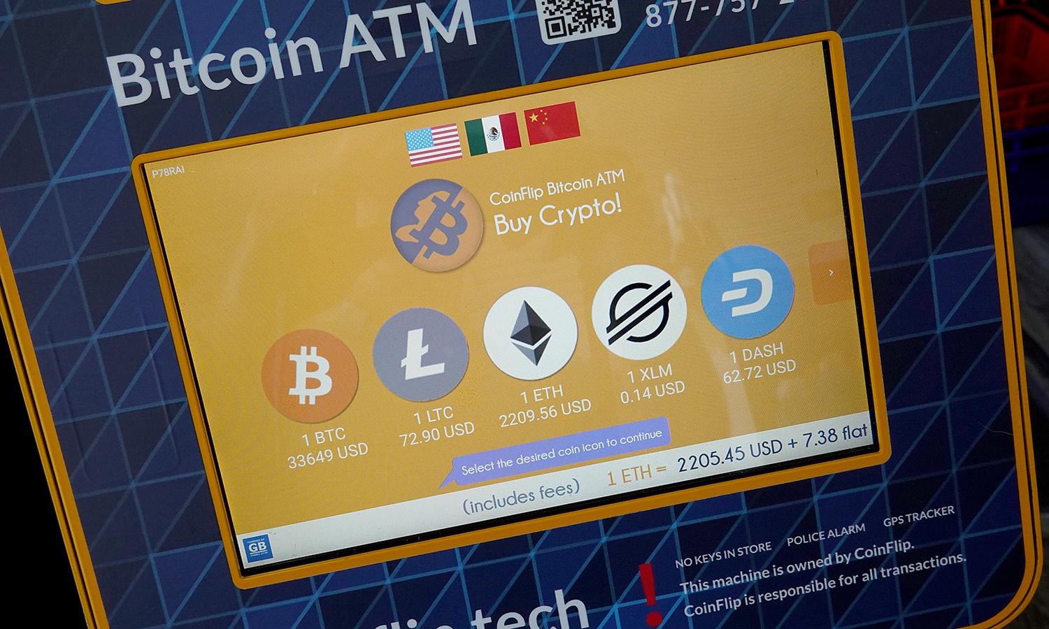 The screen of a Bitcoin ATM is seen.