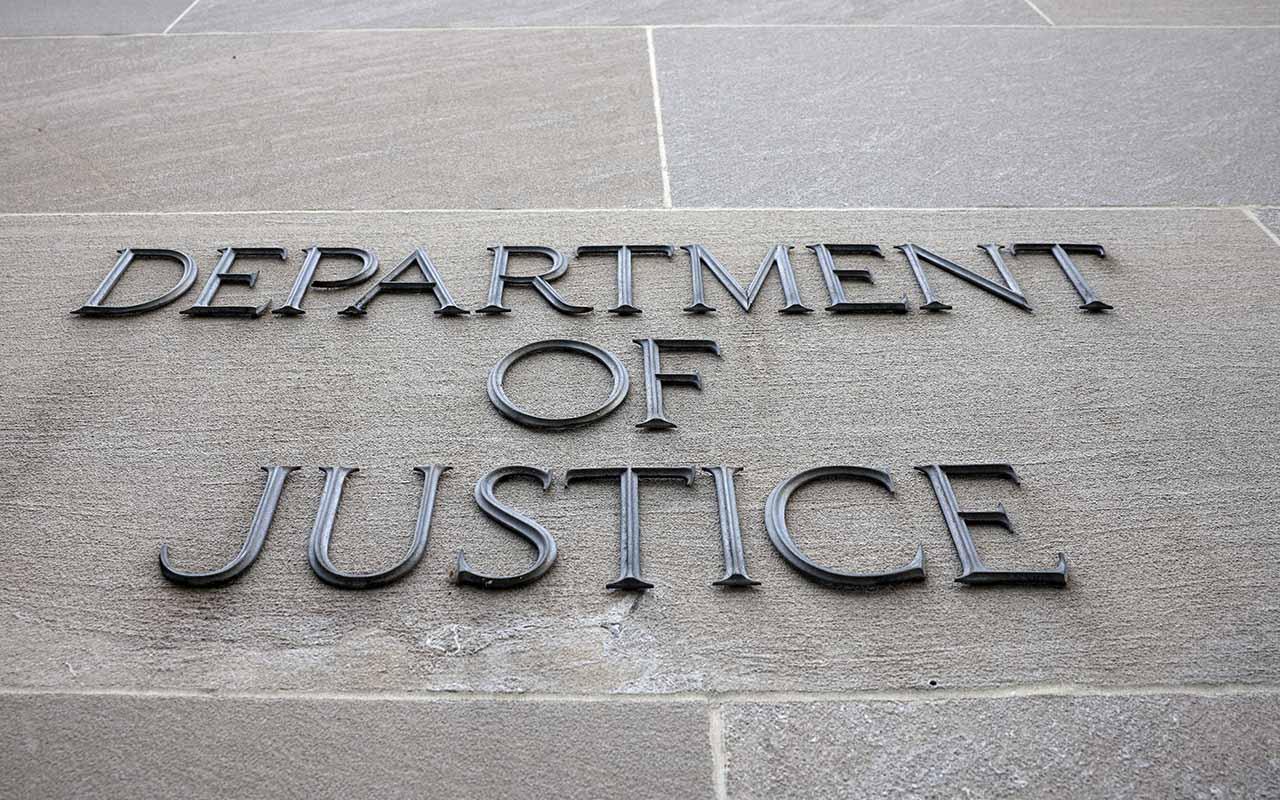 A sign at the U.S. Department of Justice is seen on June 14, 2021, in Washington.