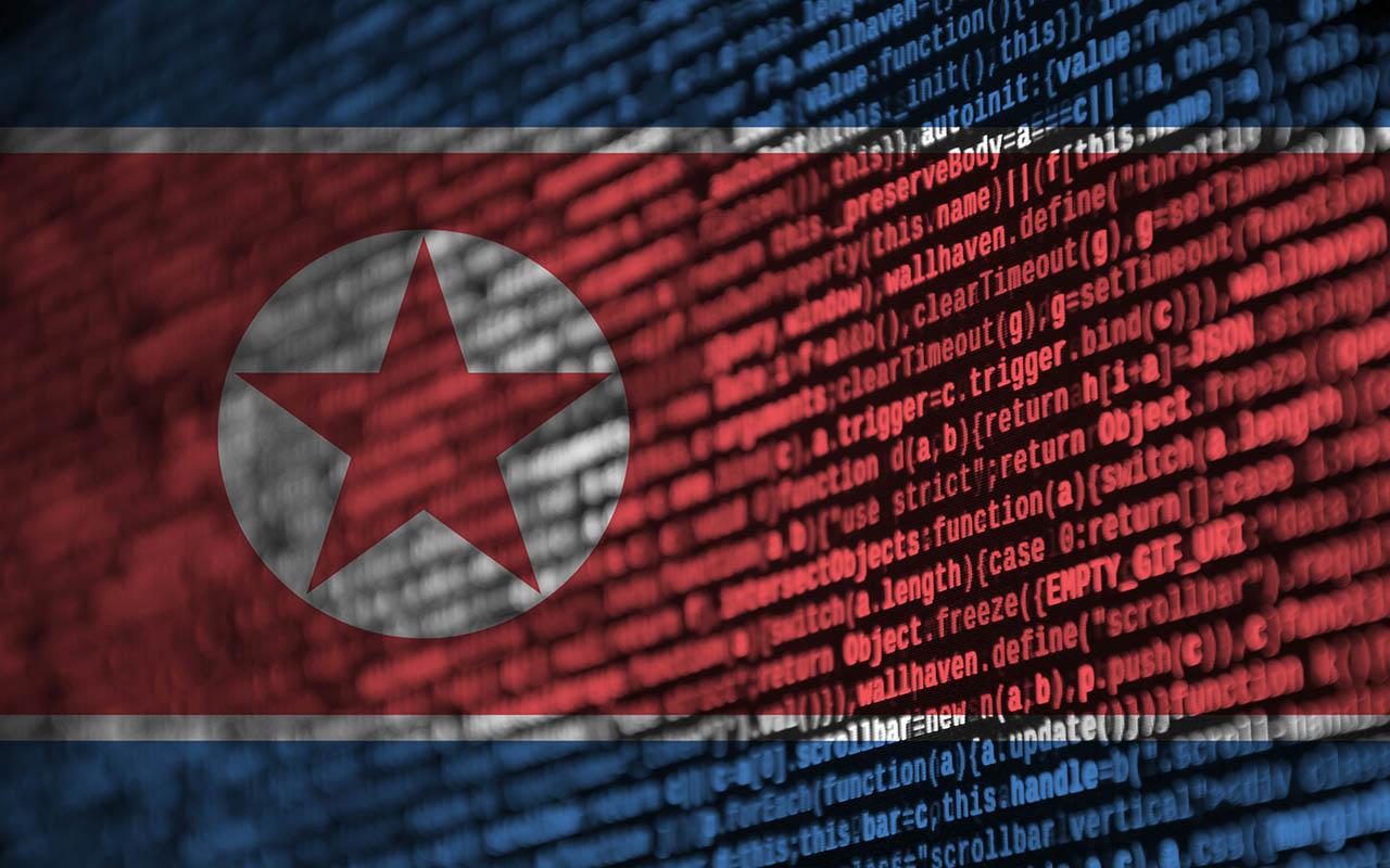 North Korea flag is depicted on the screen with the program code. The concept of modern technology and site development