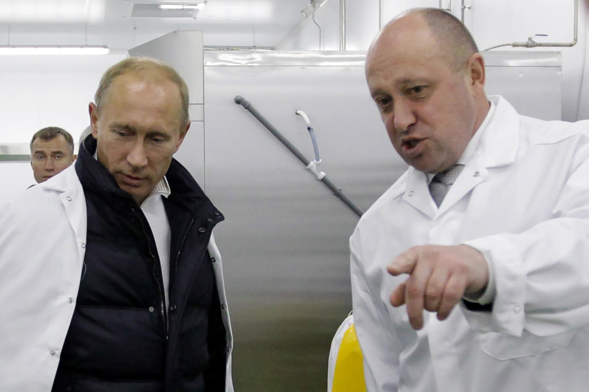 Russian President Vladimir Putin, left, and Wagner Chief Yevgeny Prizoghin. Known as “Putin’s Chef” for his lucrative catering contracts secured for the Kremlin, Prigozhin has played a major and sometimes central role in world events over the past decade. (Alexey Druzhinn / Contributor via Getty Images)