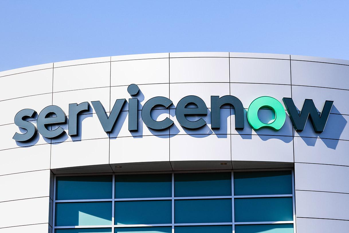 ServiceNow logo is seen on the side of a building.
