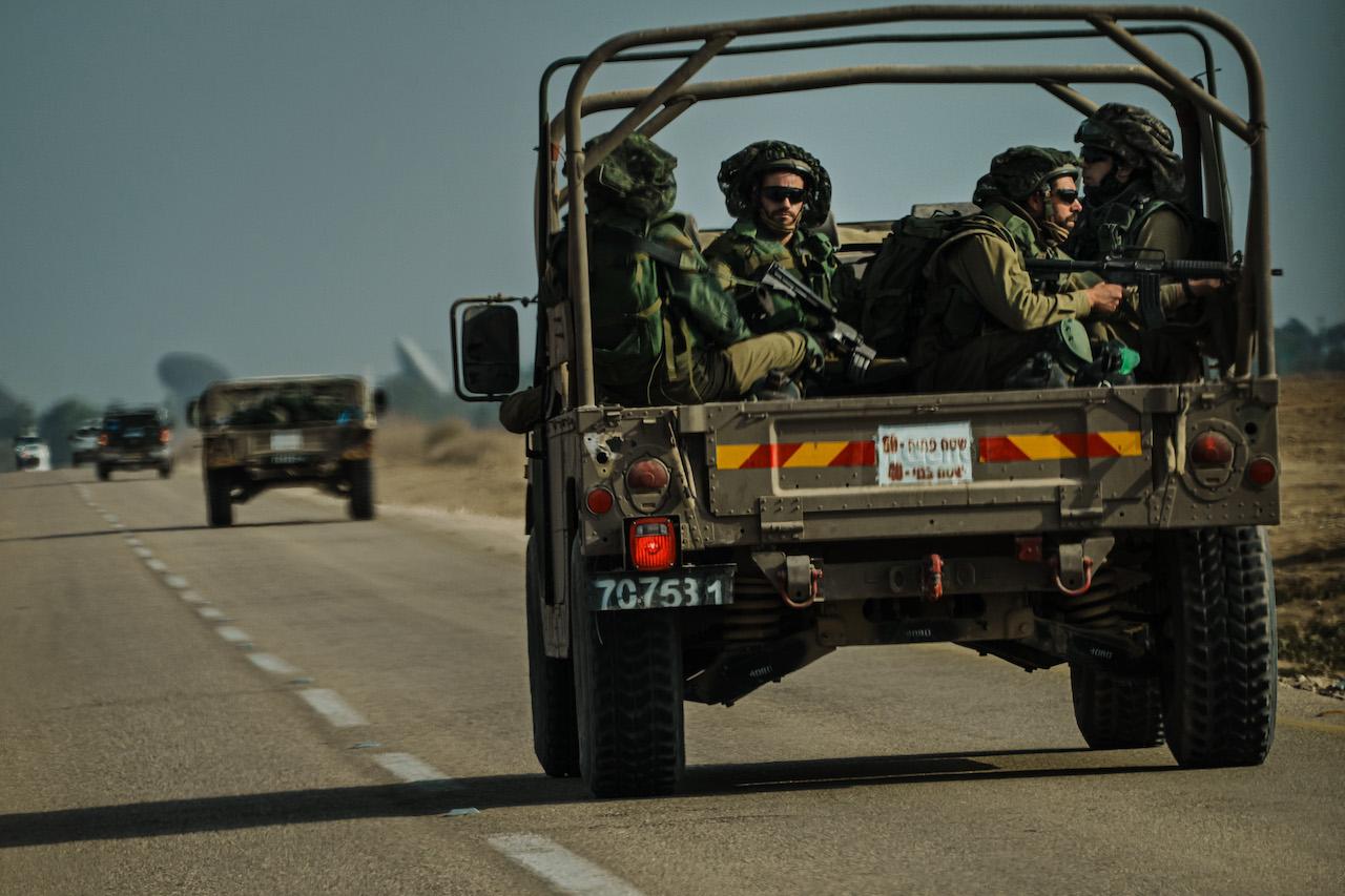 Israeli soldiers ride on a transport vehicle near Re&#8217;im, Israel, Tuesday, Oct. 10, 2023. Today’s columnist, Eyal Benishti of IRONSCALES, offers a three-step approach for cybersecurity companies as they navigate their efforts in the coming days. (MARCUS YAM / LOS ANGELES TIMES via Getty Images)